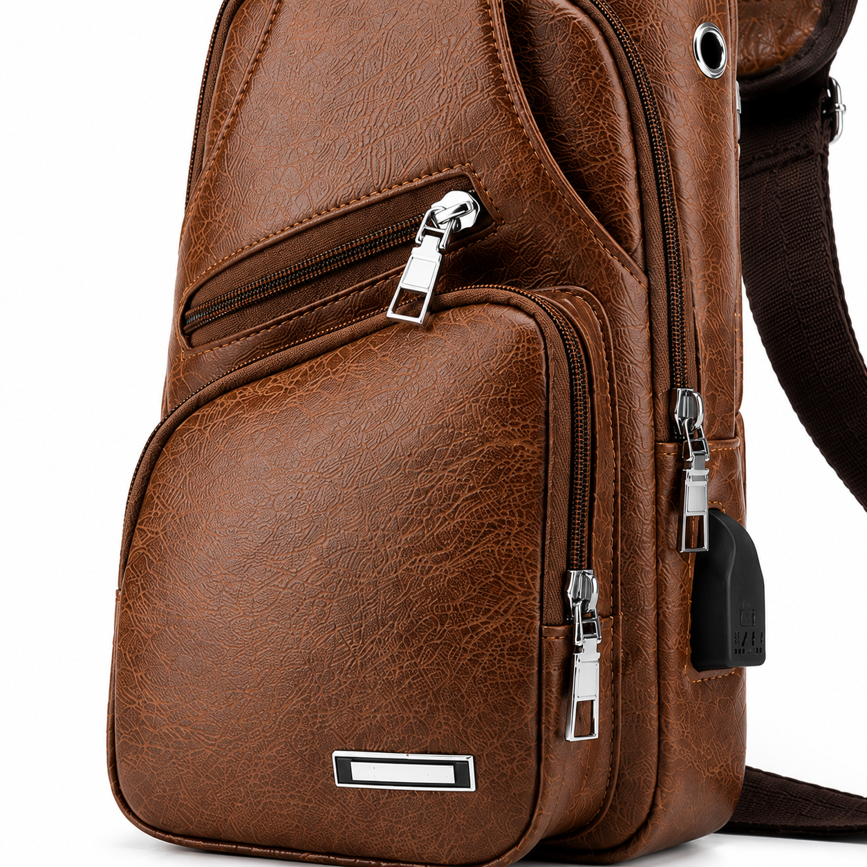 Brown leather sling bag close-up detail and pockets